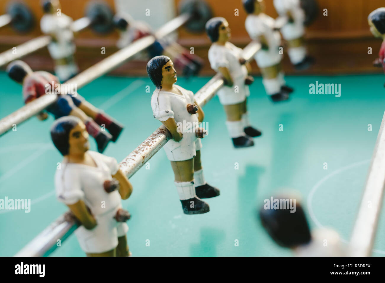 dolls of a retro foosball table to play table football Stock Photo - Alamy