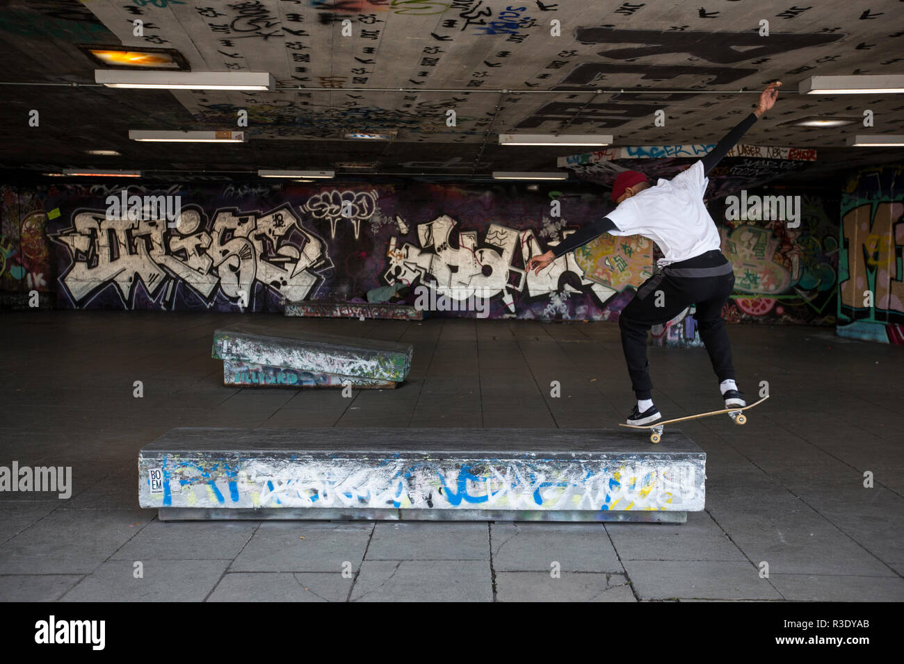 Skateboarders under the Queen Elizabeth Hall along the Southbank area of central London, England, United Kingdom Stock Photo