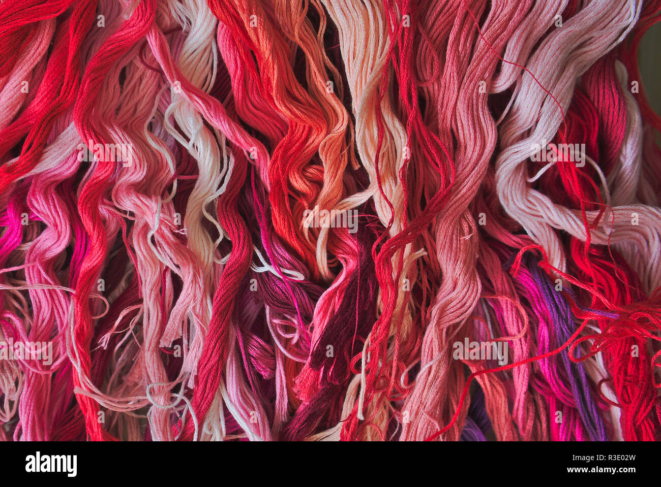 color chart of red cotton thread for embroidery Stock Photo Alamy