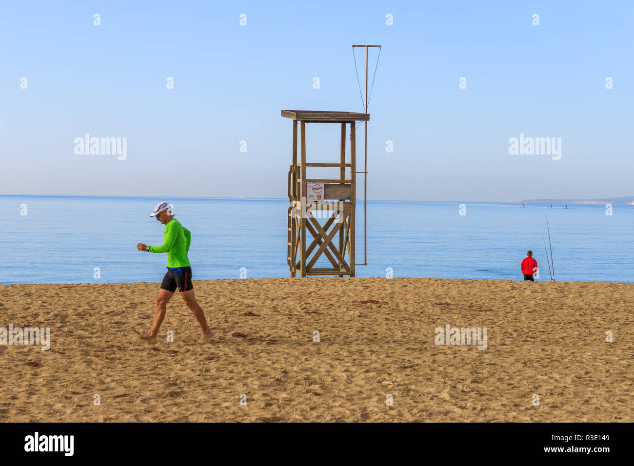 Man running on the beach, Playa de Palma , Mallorca, Spain Stock Photo