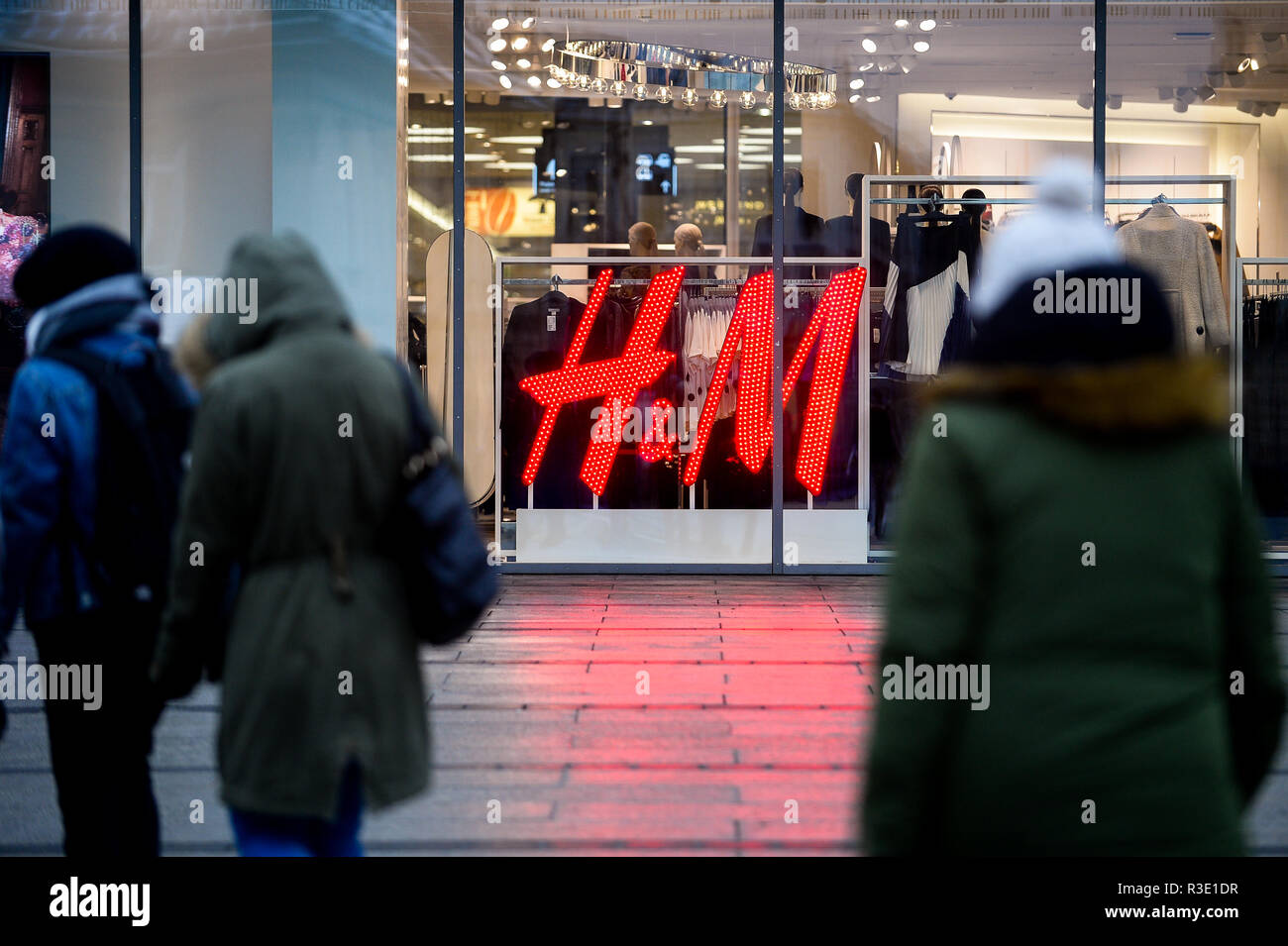 People seen walking by a H&M sign ahead of the Black Friday Stock Photo -  Alamy