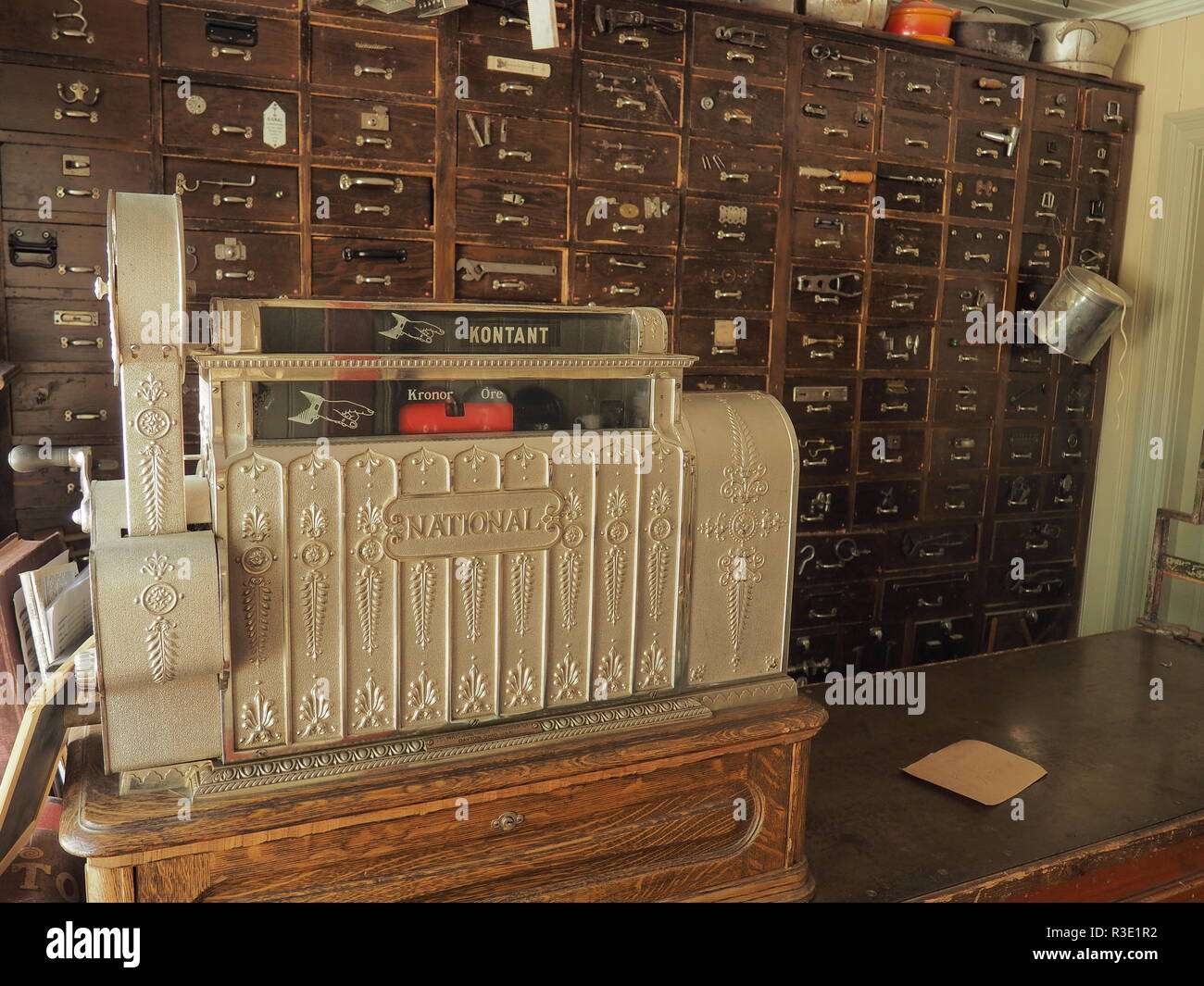 The old cash box in the vintage pharmacy. Taken in some Swedish historical park. Stock Photo