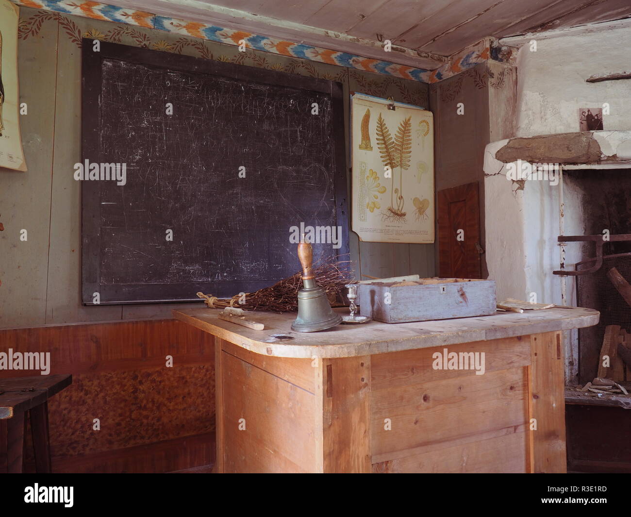 The desk and the blackboard in the 19th century classroom. Taken in some Swedish historical park. Stock Photo