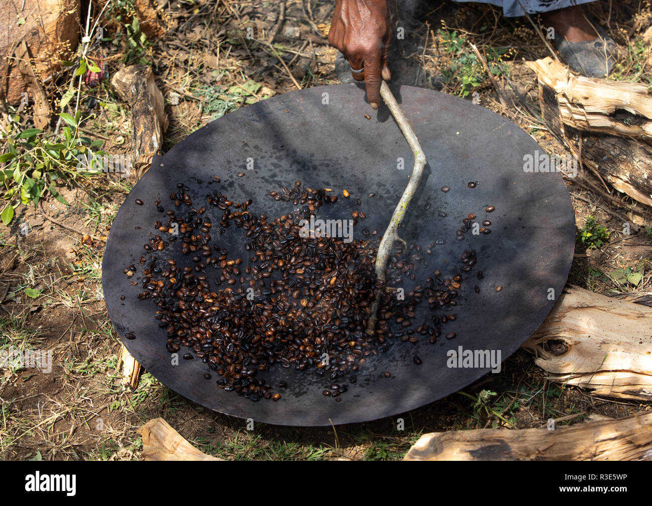 Ethiopian woman roasting coffee beans hires stock photography and