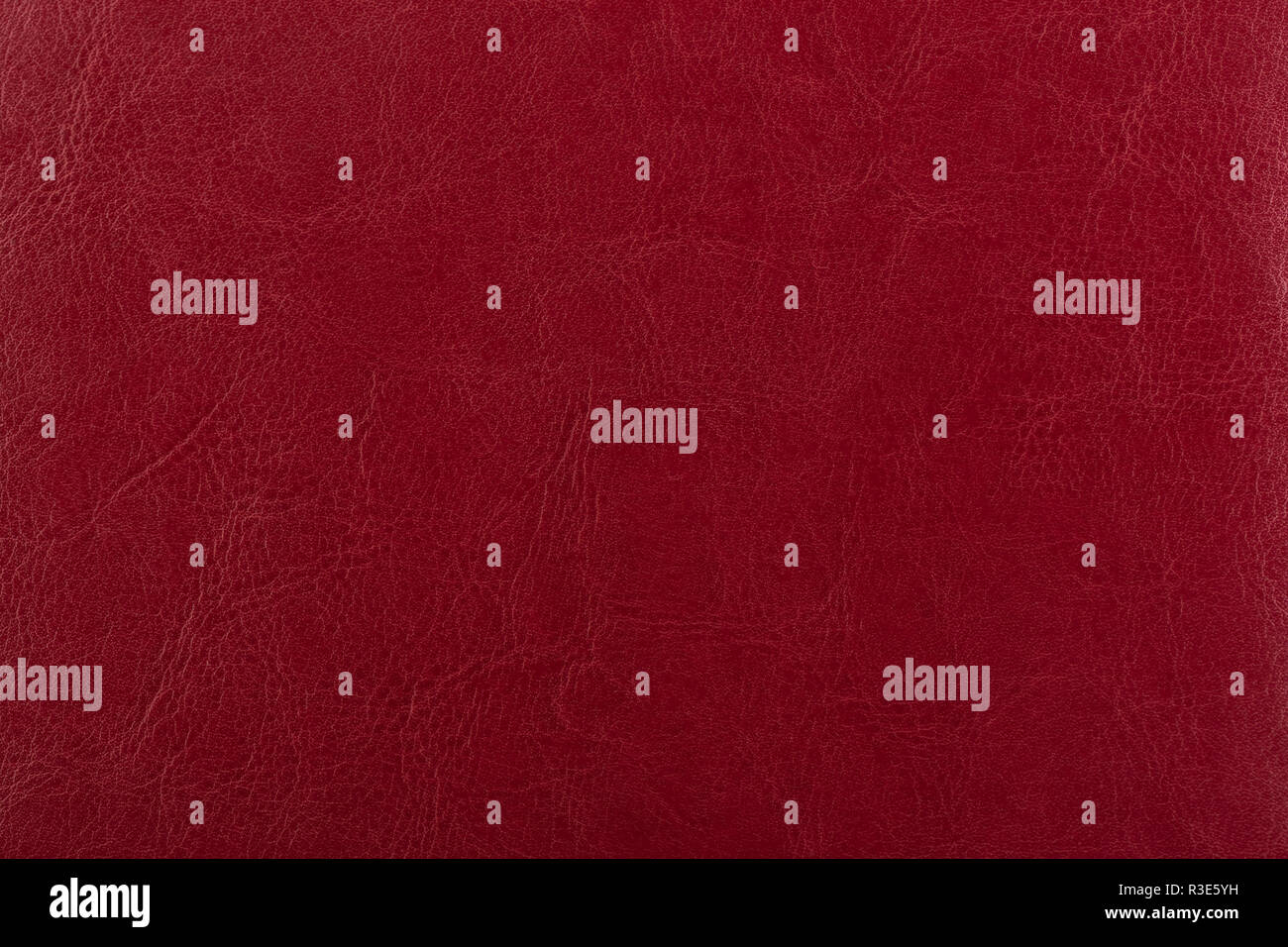 Dark red leather surface as a background, leather texture. Skin  Stock Photo