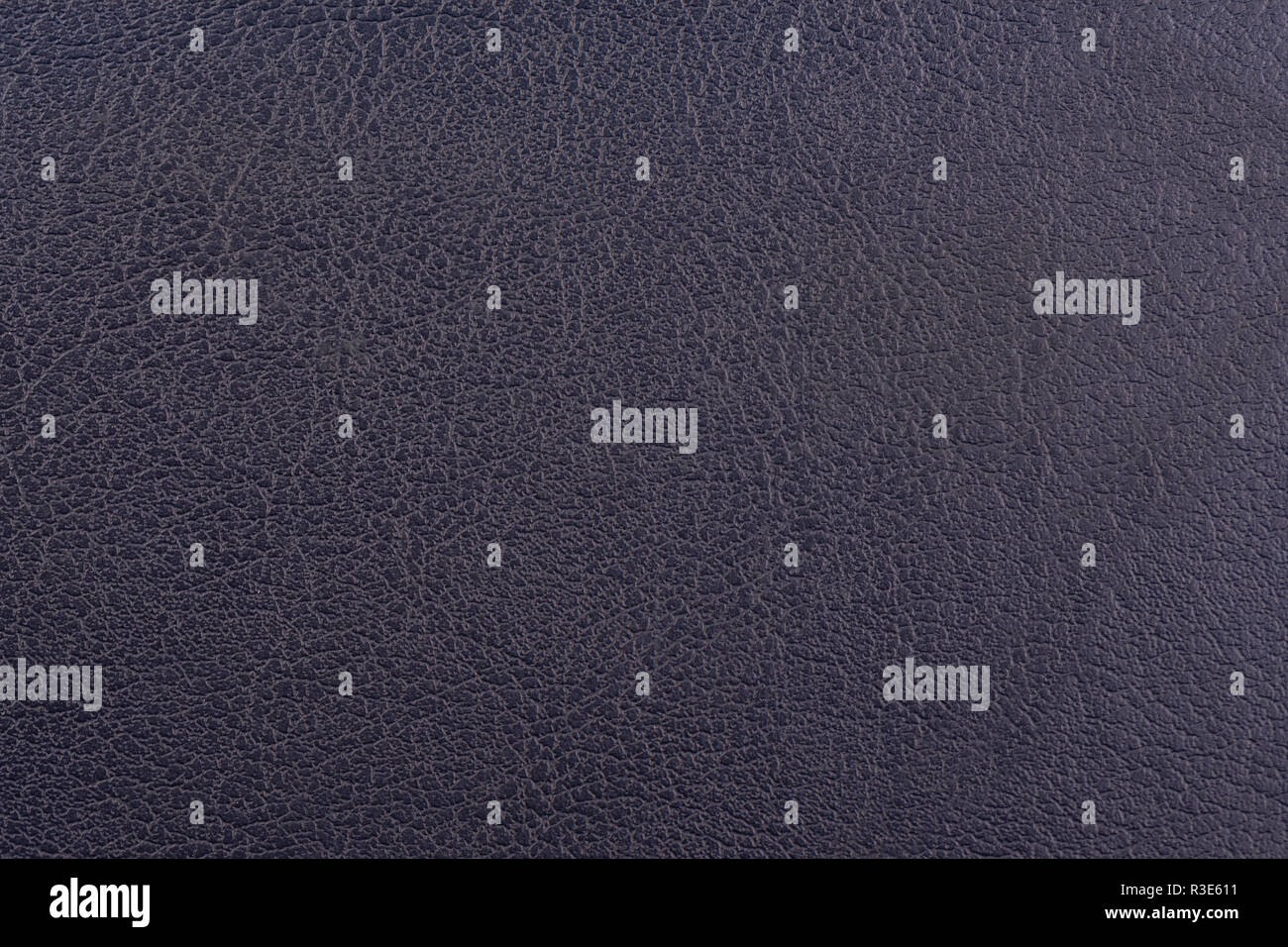 Dark blue leather surface as a background, leather texture. Skin Stock Photo