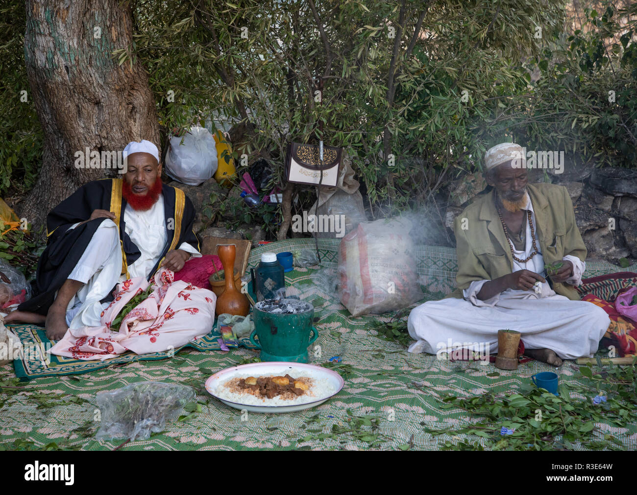 Harari men chewing khat during a sufi celebration, Harari Region, Harar, Ethiopia Stock Photo