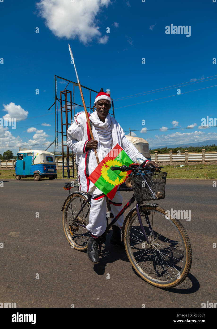 Ethiopian man on a bicycle during a oromo liberation front party rally, Oromia, Waliso, Ethiopia Stock Photo