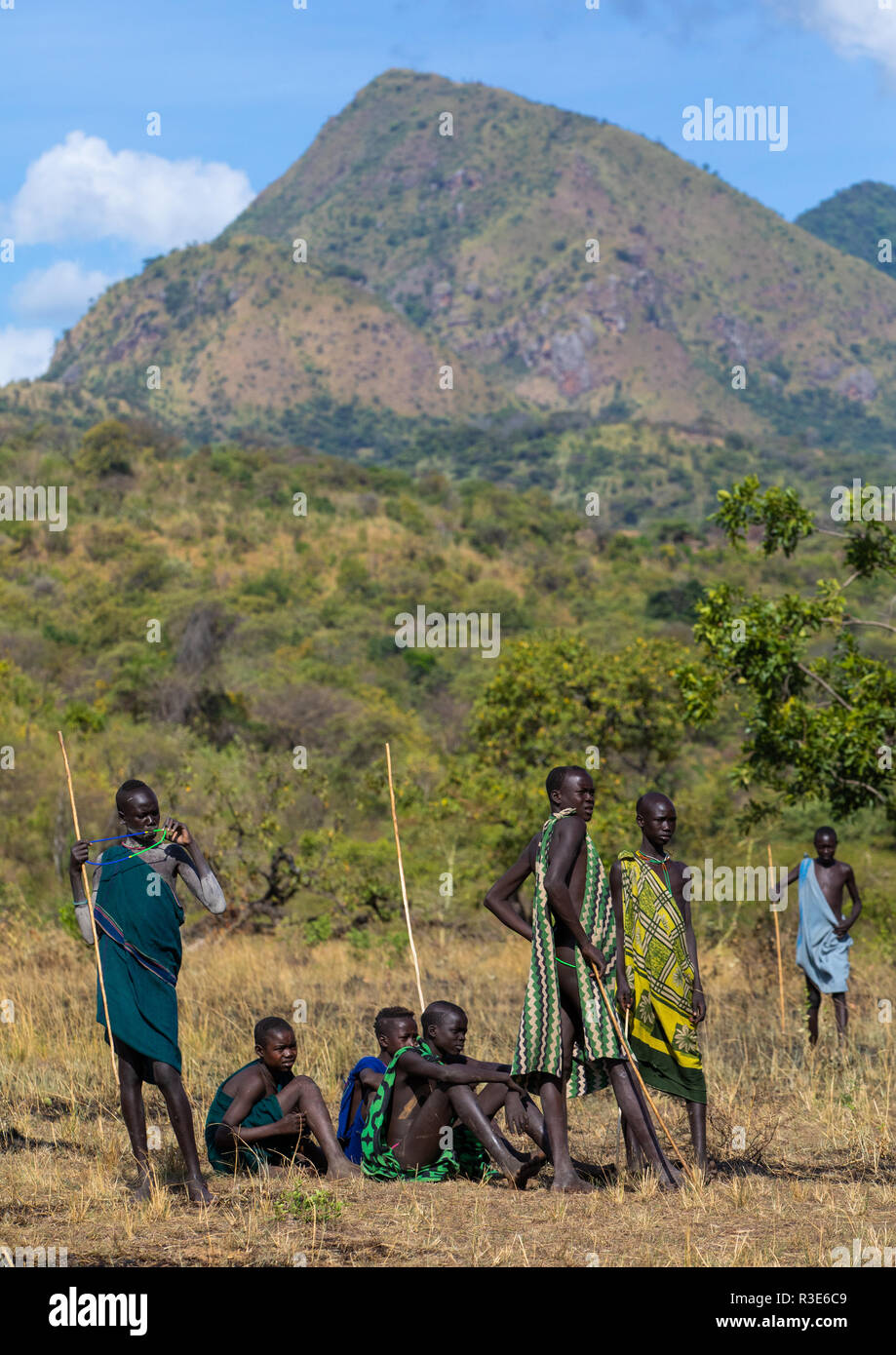 Suri tribe teenage boys during a donga stick fighting ritual, Omo valley, Kibish, Ethiopia Stock Photo