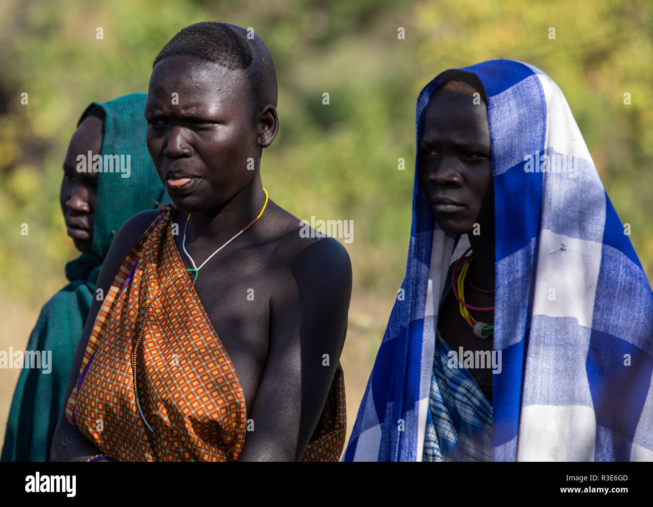 Suri tribe women watching a donga stick fighting ritual, Omo valley, Kibish, Ethiopia Stock Photo