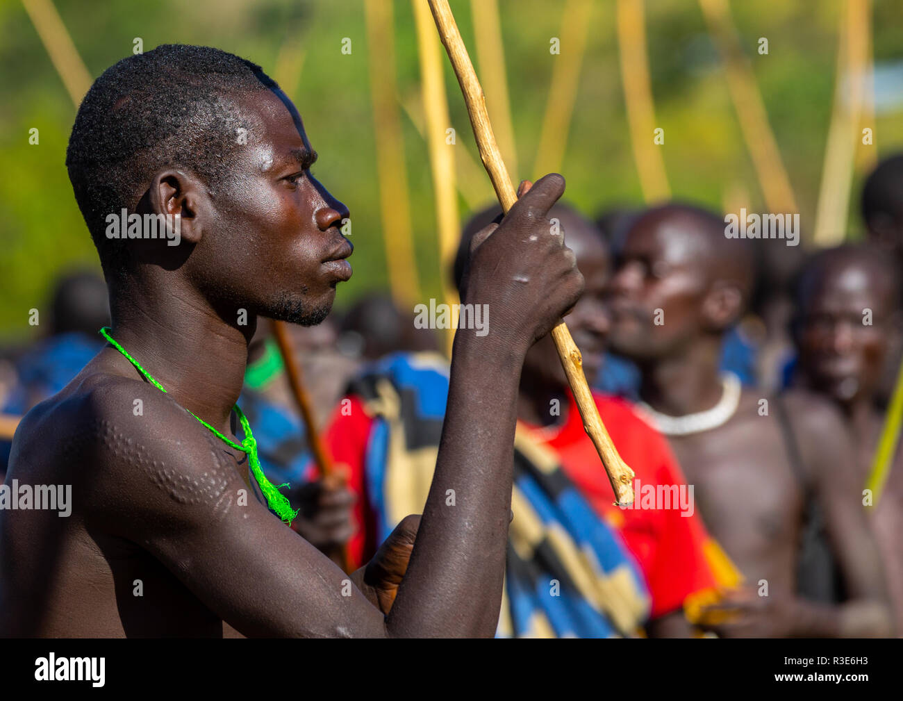 Suri tribe warriors parading before a donga stick fighting ritual, Omo valley, Kibish, Ethiopia Stock Photo