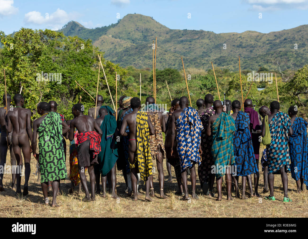 Group of suri tribe warriors during a donga stick fighting ritual, Omo valley, Kibish, Ethiopia Stock Photo