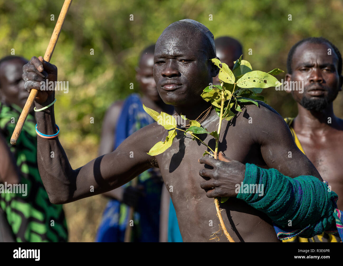 Suri tribe warrior parading before a donga stick fighting ritual, Omo valley, Kibish, Ethiopia Stock Photo