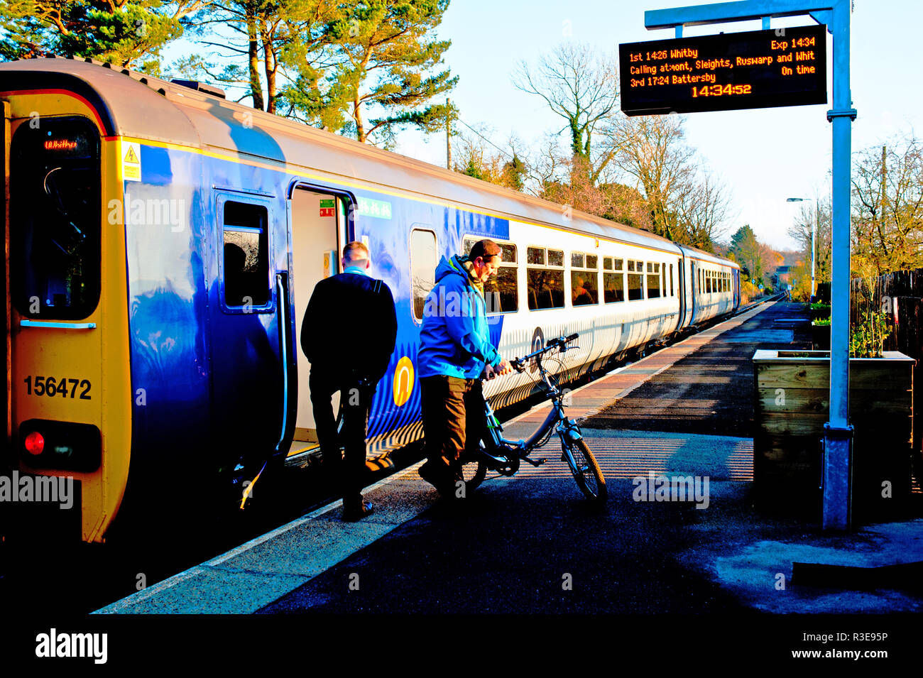 Passenger with bike leaving train, Great Ayton Railway Station, Great