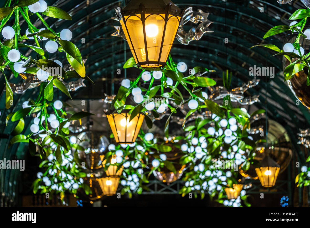 Christmas lights and decorations at the Covent Garden market in London at night Stock Photo