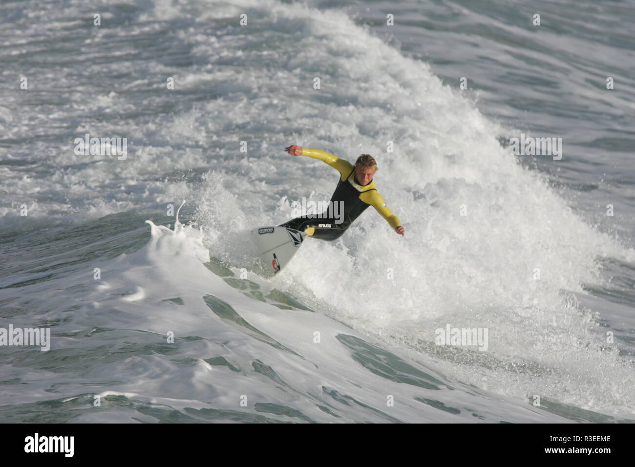 Surfing fun with red wetsuit Cornwall Stock Photo Alamy