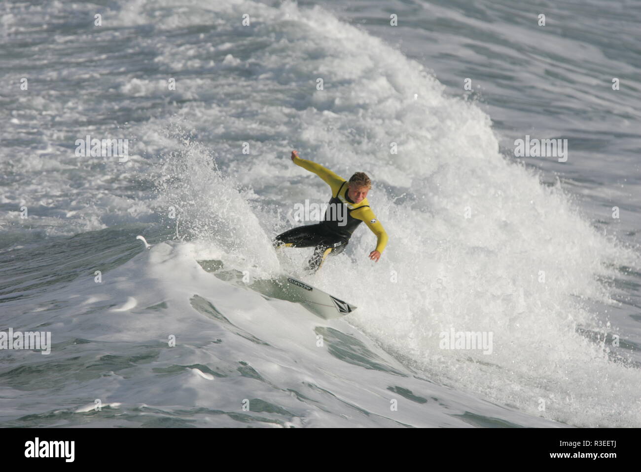 Surfing fun with red wetsuit Cornwall Stock Photo Alamy