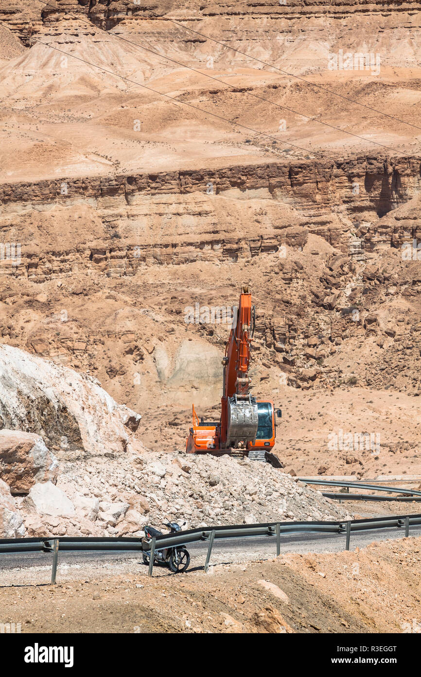 excavator building a mountain road in the atlas mountain Stock Photo ...