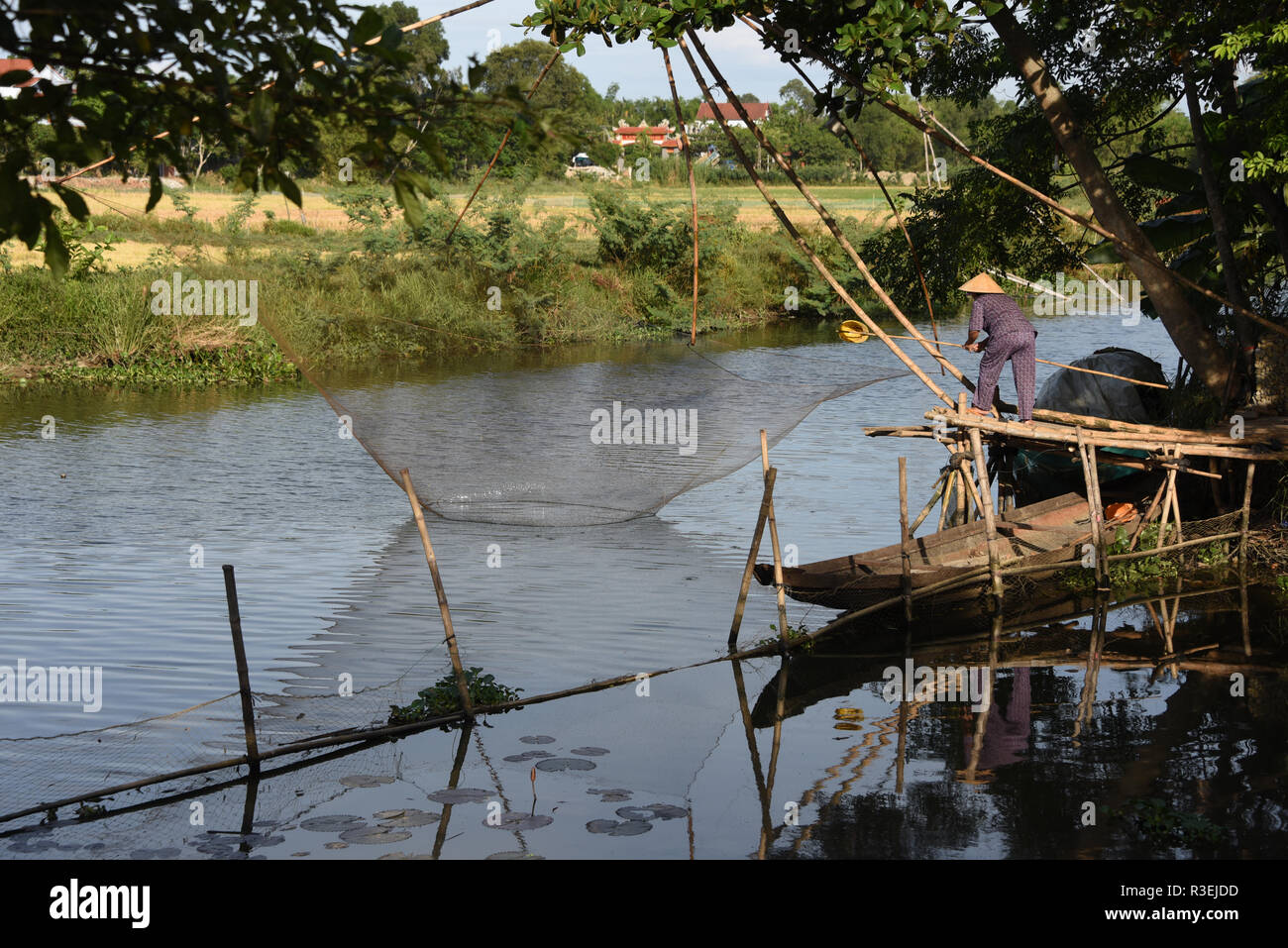 Vietnamese Woman Fishing Stock Photo