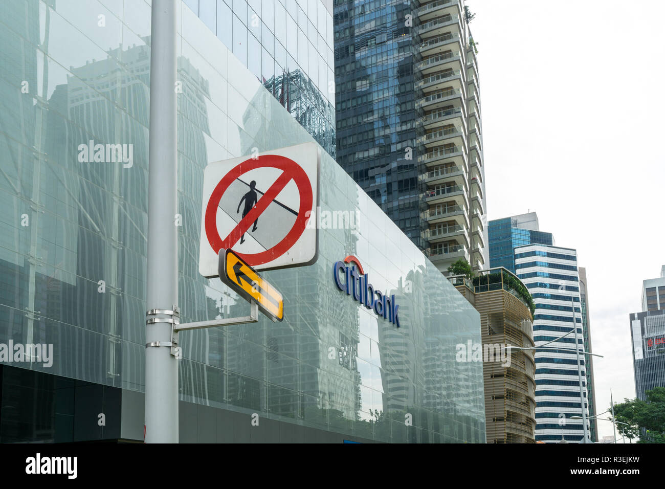 Singapore - September 16 2017: 'No pedestrians' road sign next to Citibank sign in the office building in Central Business District in Singapore with  Stock Photo