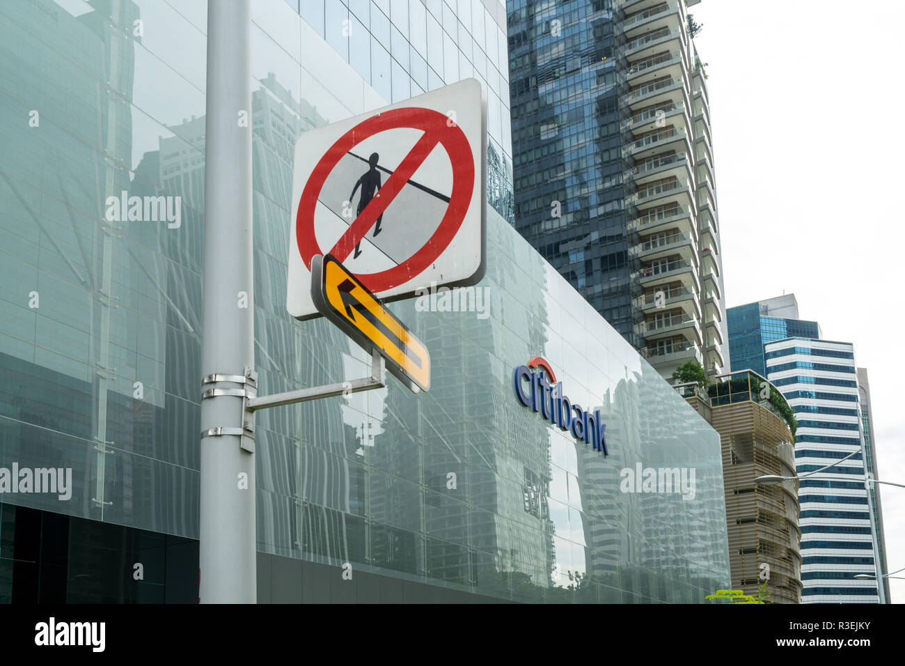Singapore - September 16 2017: "No pedestrians" road sign next to Citibank sign in the office building in Central Business District in Singapore with  Stock Photo