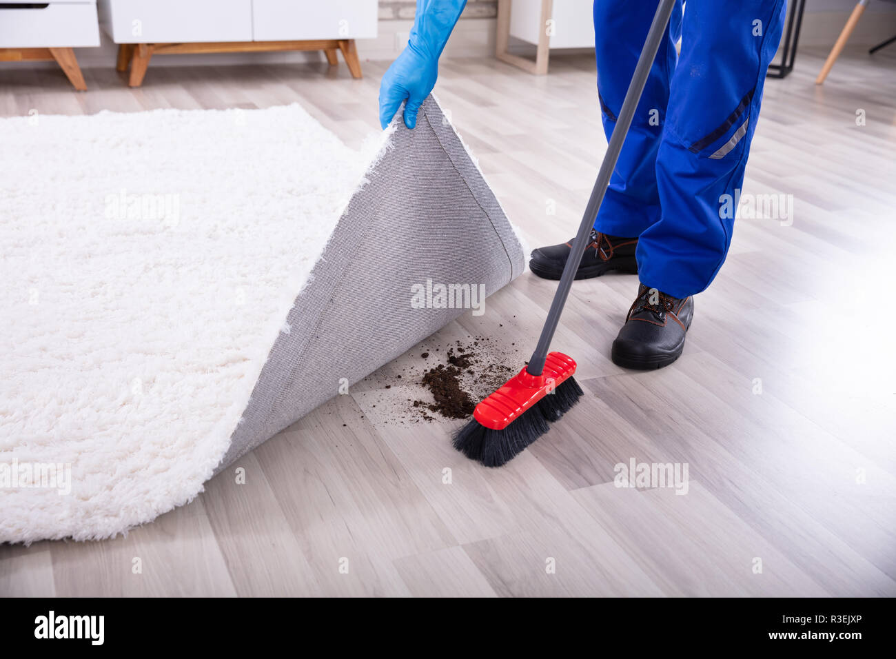 Sweeping under carpet hires stock photography and images Alamy