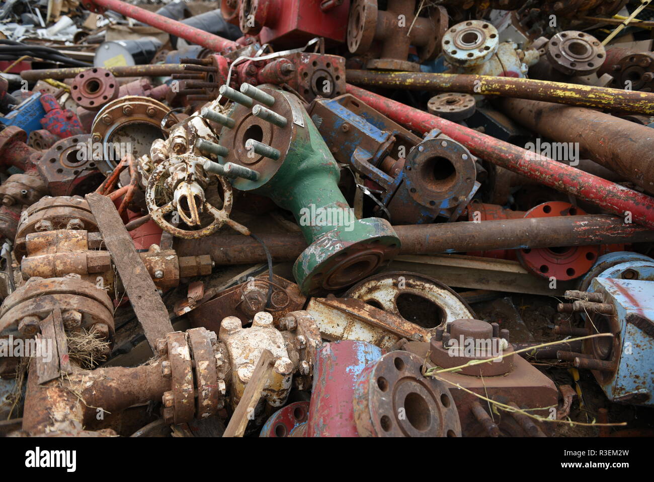 Large colorful pile of discarded industrial scrap iron for scrap metal recycling in the USA Stock Photo