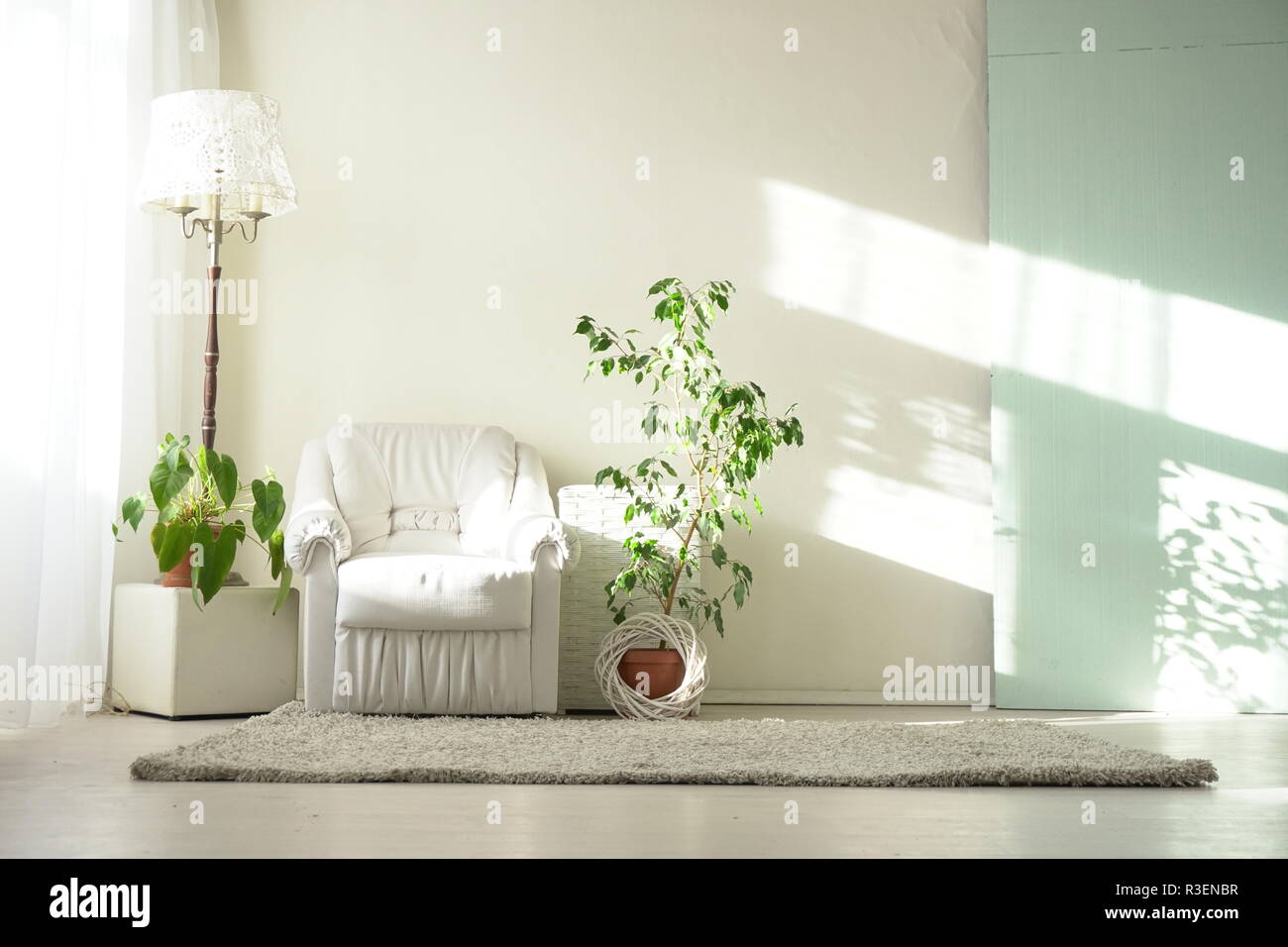 interiors white room with armchair and Stock Photo - Alamy