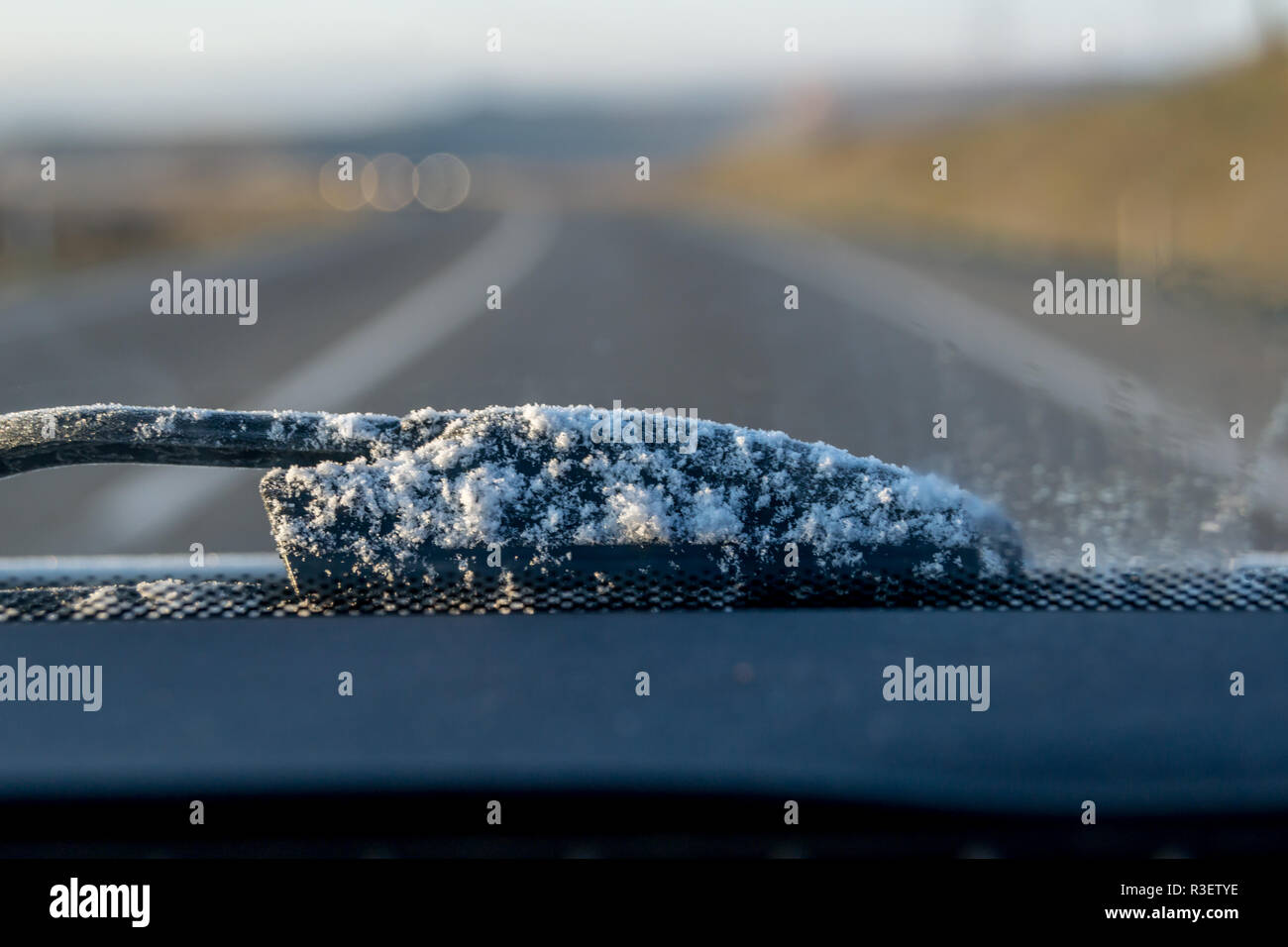 Frozen windshield wiper on car, inside view Stock Photo Alamy