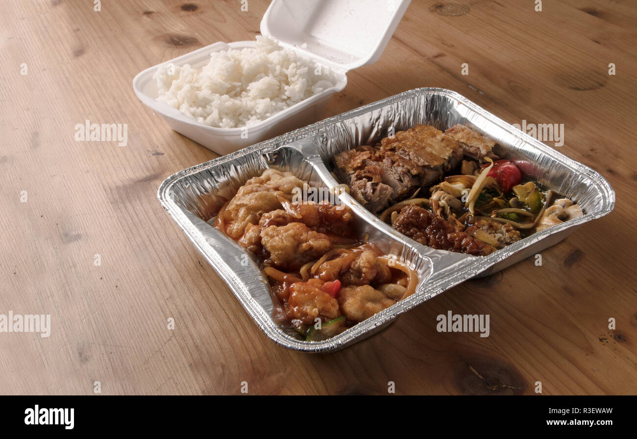Styrofoam box for food on wooden table Stock Photo - Alamy