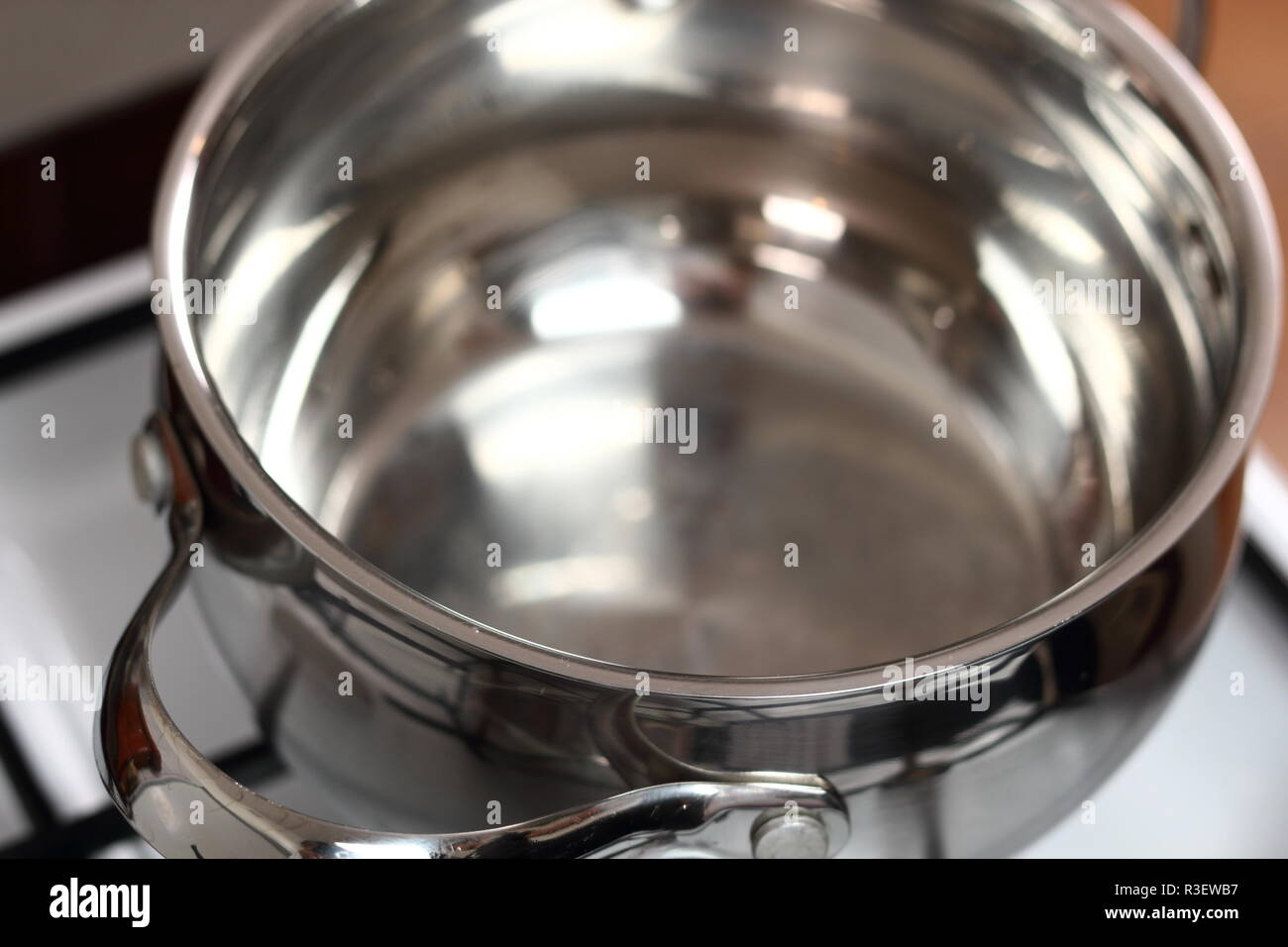 Sauce Pan on Gas Stove Stock Photo Alamy