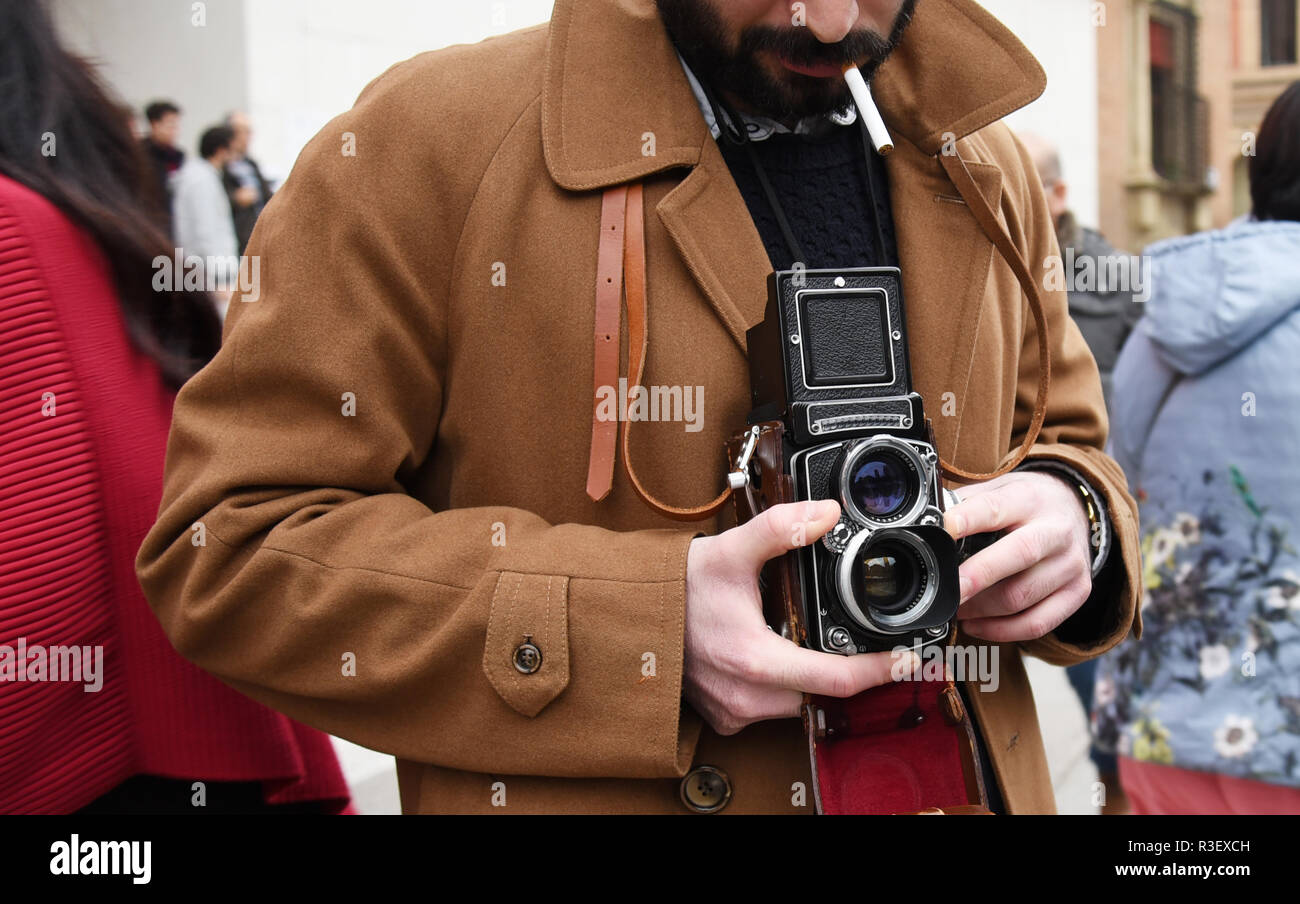 Close-up of Hipster man with the vintage camera. Photographer with a famous  retro camera. Bologna, Italy Stock Photo - Alamy