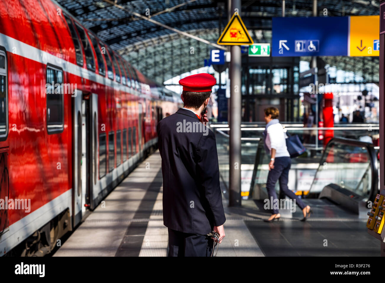 A railway worker at work in the main train station (Hauptbahnhof), Berlin, Germany. Stock Photo