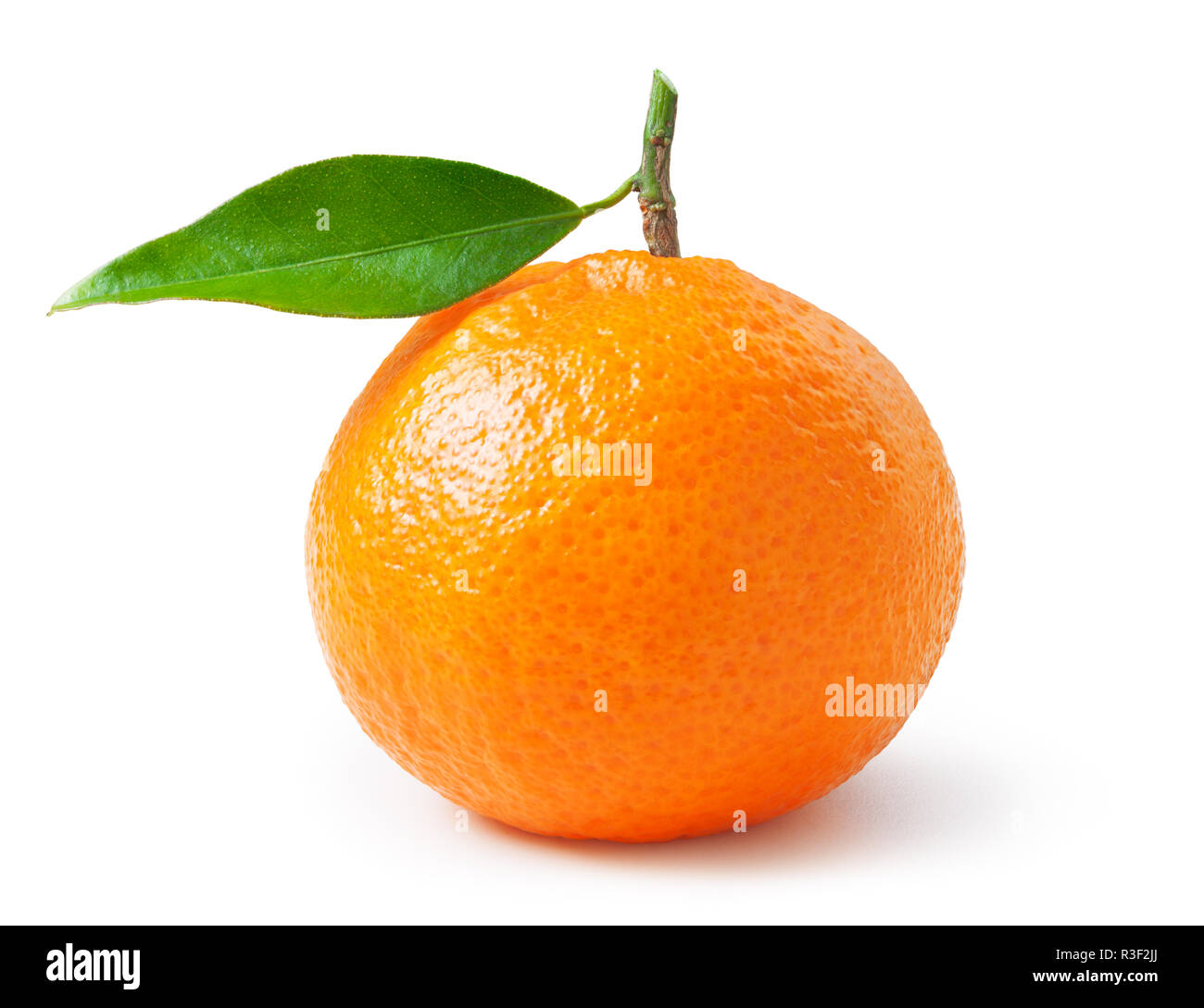 Tangerine or clementine with green leaf isolated on white background
