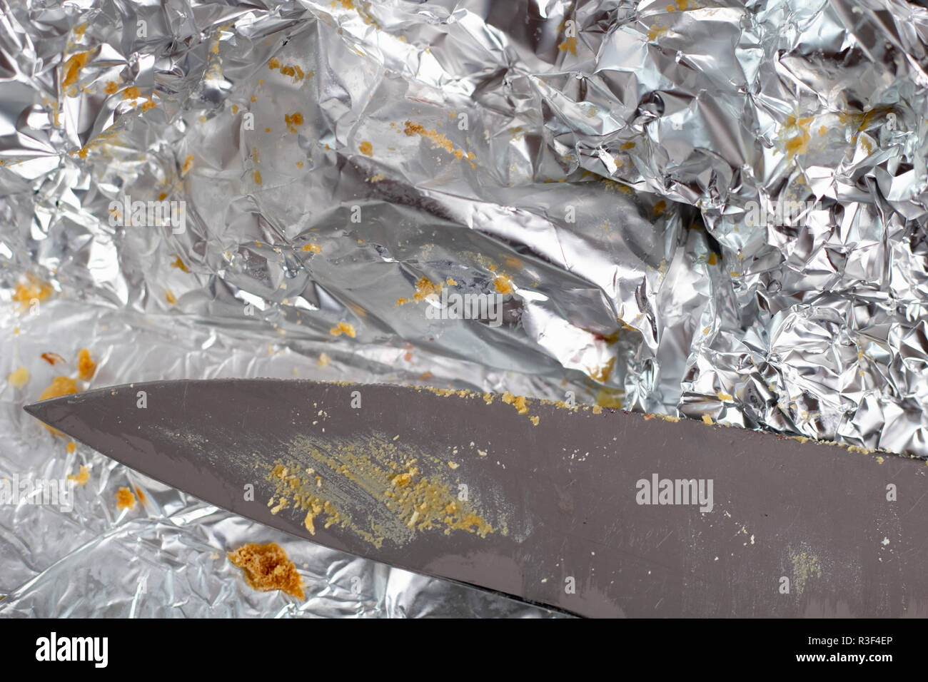 Aluminium foil as wrap and dirty knife Stock Photo Alamy