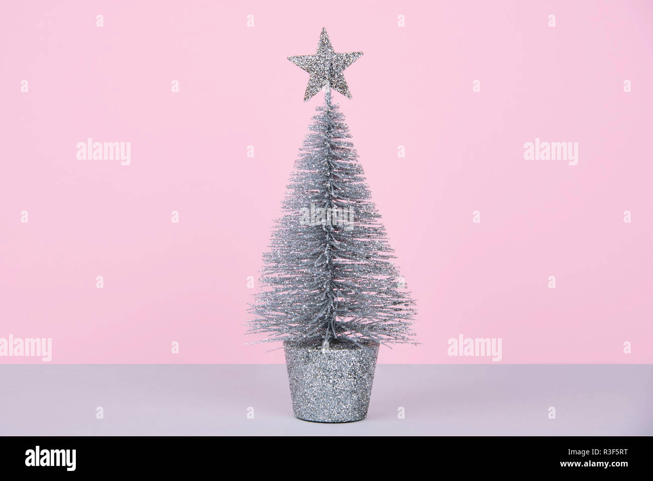 Christmas tree over light blue background Stock Photo - Alamy
