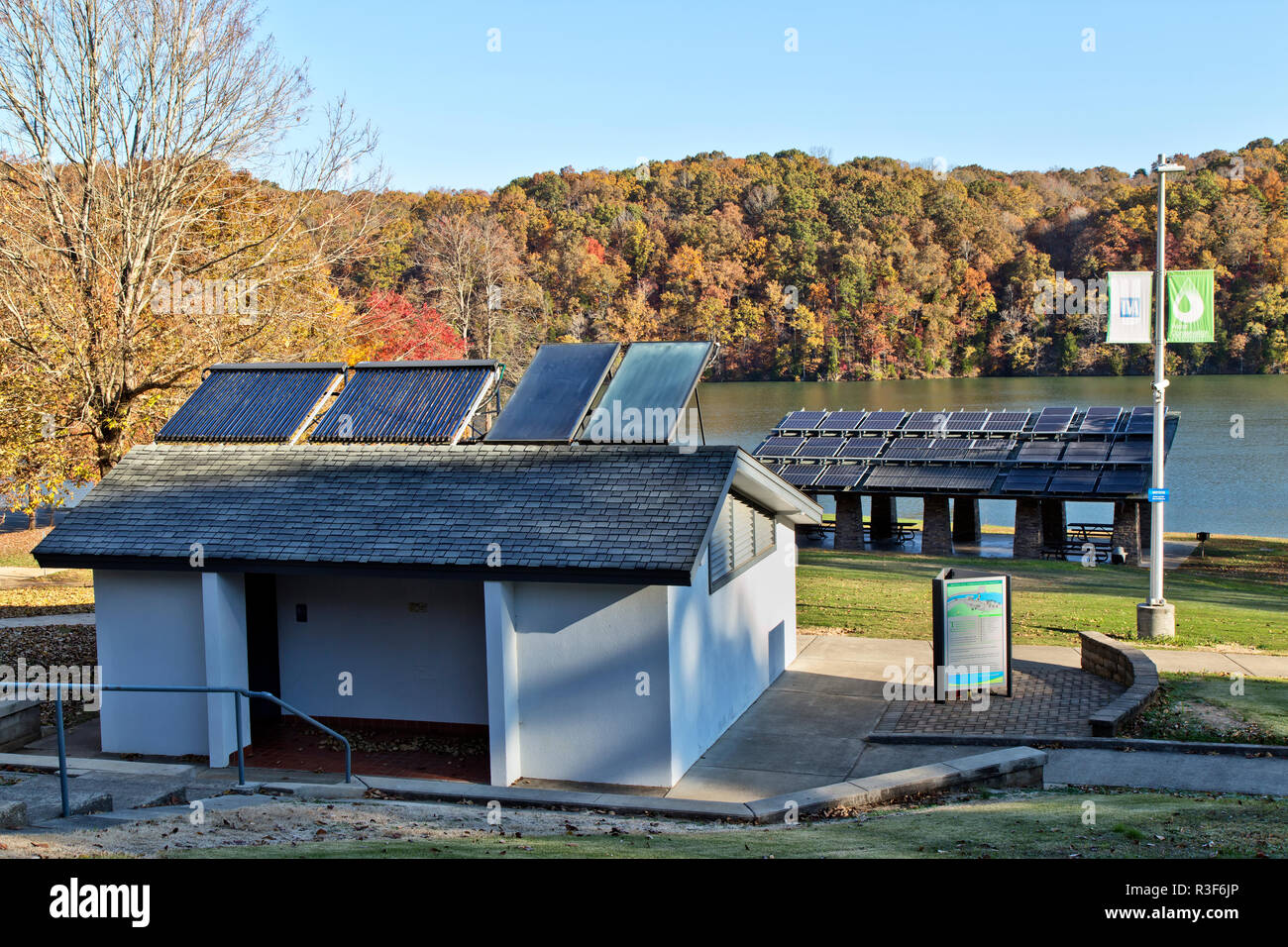 Solar hot water heaters on bathroom roof,  with solar panels in background, facilitating Melton Hill Dam Recreation Area Campground. Stock Photo