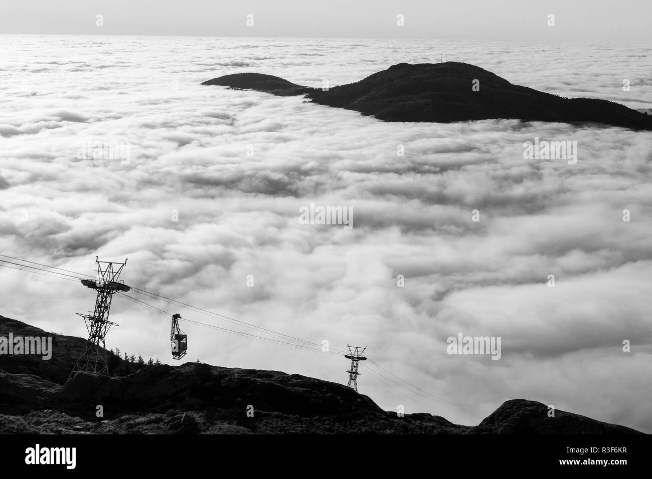 Thick fog surrounding large area of Western Norway. No wind, temperatures just above zero C (32 F). View from top of Mount Ulriken, Bergen, Norway tow Stock Photo