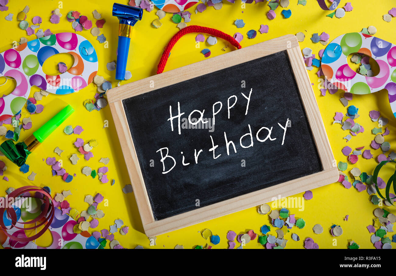 Birthday Party Happy Birthday Text On A Blackboard Confetti And