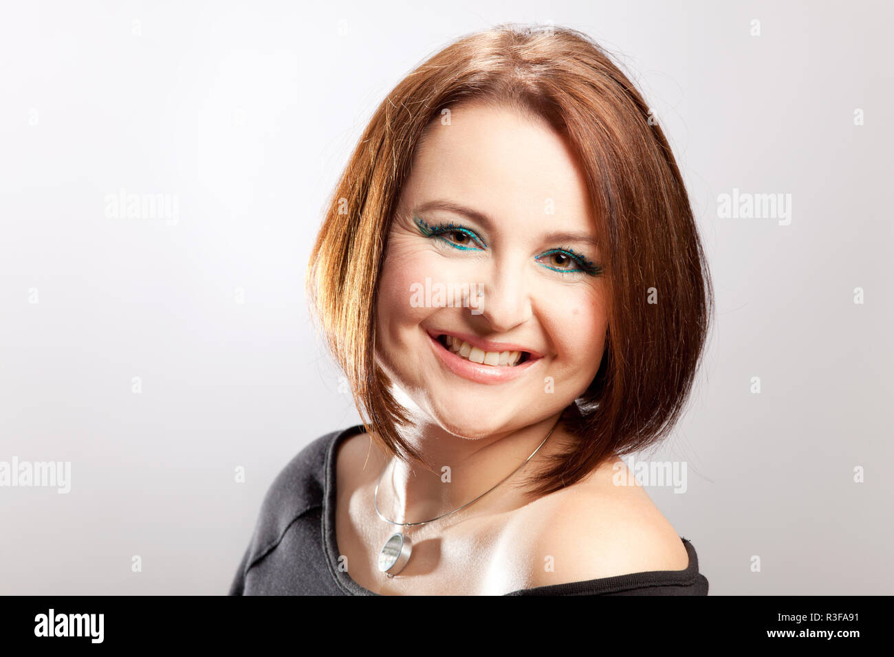 portrait of a laughing woman with pageboy Stock Photo