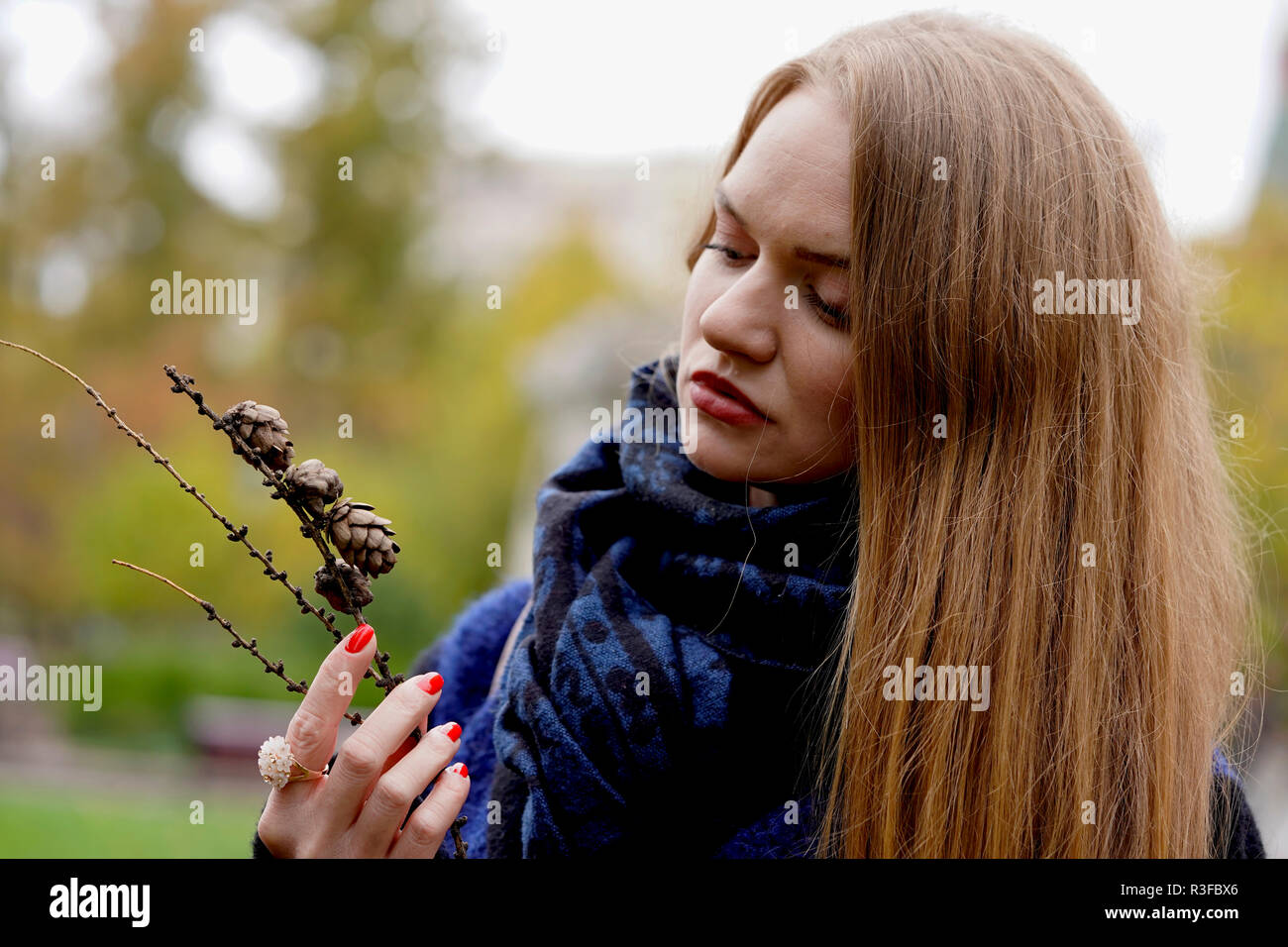 Russian girl shooting for autumn season in Moscow, Blue eye girl with blonde hairs Stock Photo