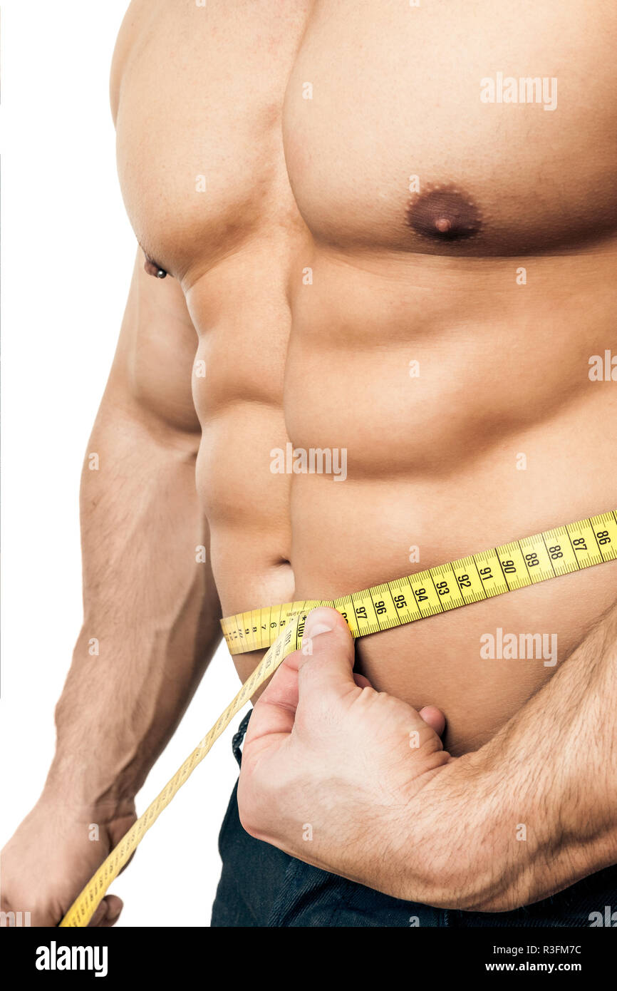 Image of muscular man measure his waist with measuring tape in centimeters  Stock Photo - Alamy