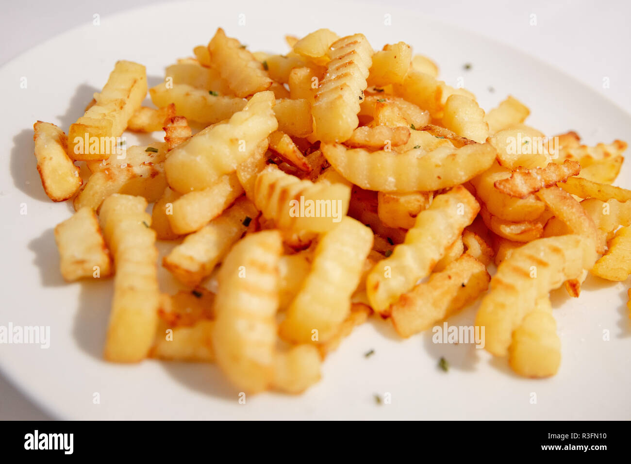 Chips, chrinkle chips cooked, french fries food Stock Photo Alamy