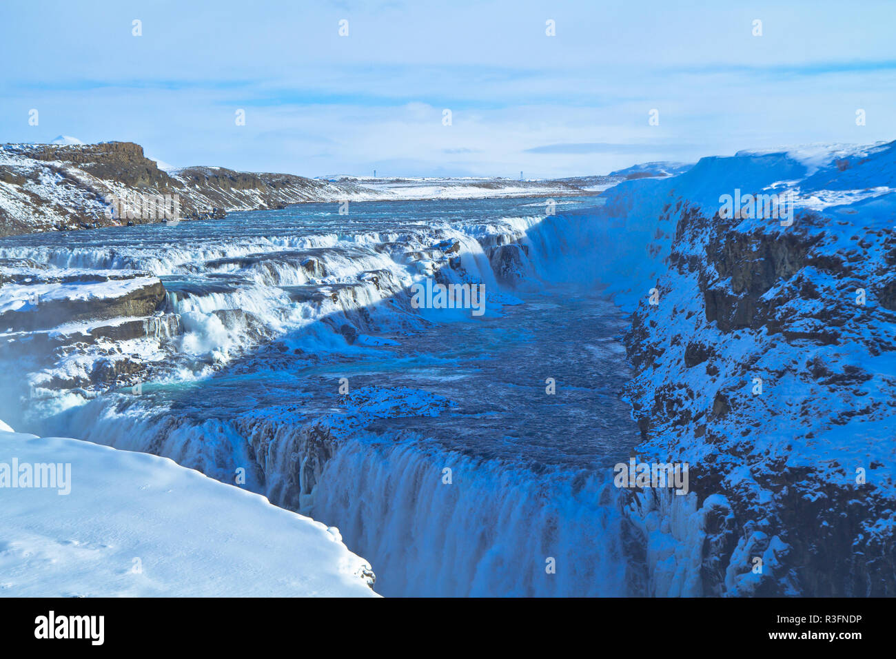 The Golden Circle, Iceland, Gullfoss waterfall and Strokkur which continues to erupt every 5–10 minutes Stock Photo