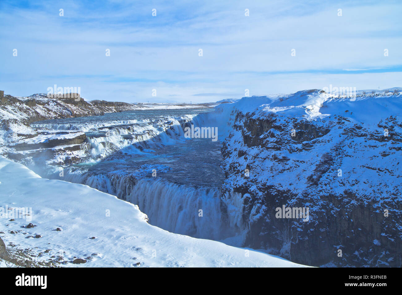 The Golden Circle, Iceland, Gullfoss waterfall and Strokkur which continues to erupt every 5–10 minutes Stock Photo