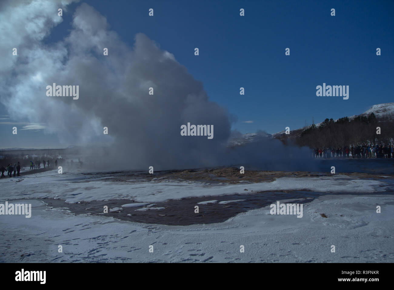 Erupting Strokkur geyser (geysir) in winter, The Golden Circle, Iceland, Gullfoss waterfall and Strokkur which continues to erupt every 5–10 minutes Stock Photo