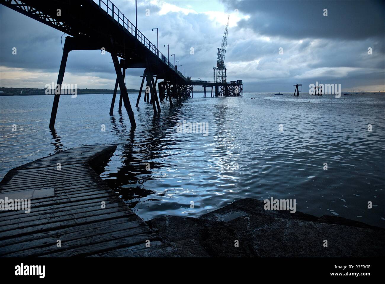Derelict Disused Oil Terminal, Rock Ferry, River Mersey, Wirral, Merseyside, UK Stock Photo