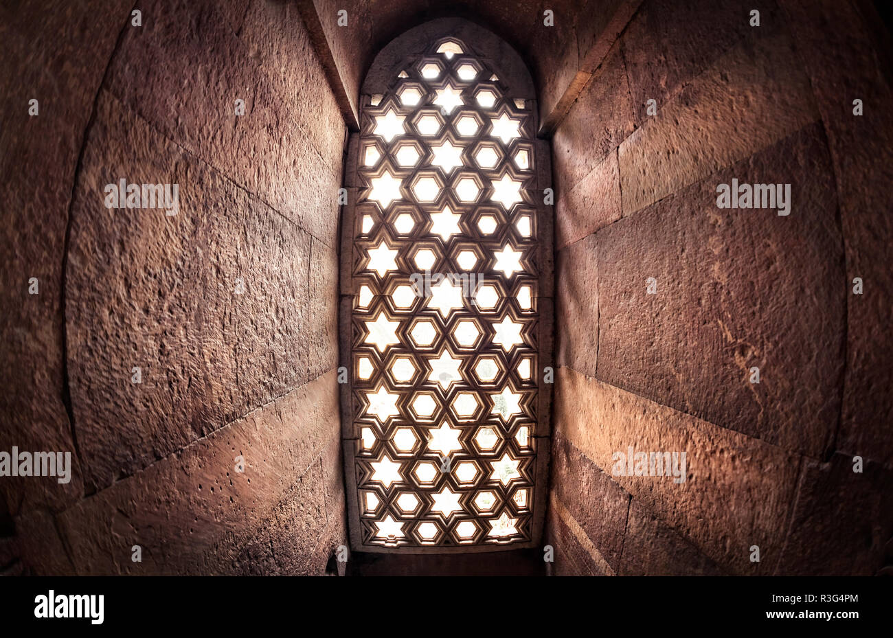 Window with sunglow in Qutub Minar complex in Delhi, India Stock Photo