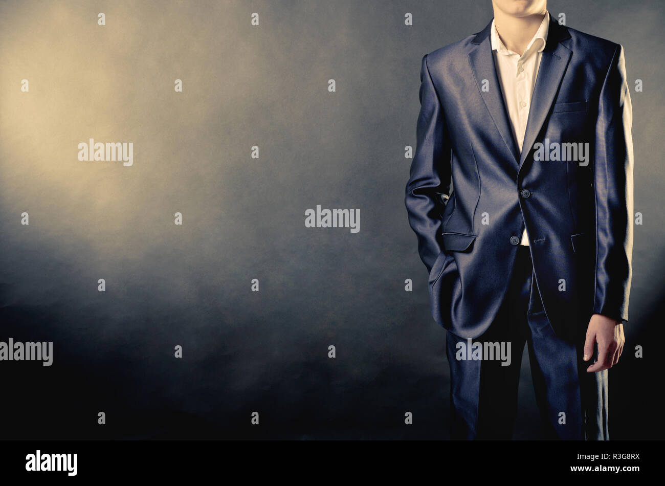 man in suit on a black background Stock Photo - Alamy