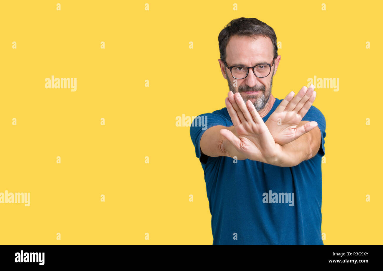 Handsome middle age hoary senior man wearin glasses over isolated ...